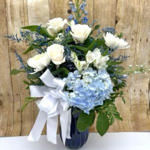 New baby boy flower arrangement with blue tones and fresh flowers